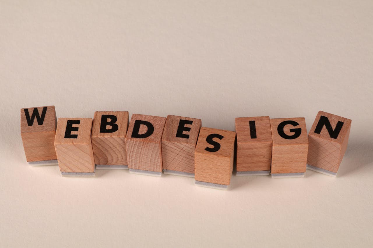 hero-img Wooden blocks spelling web design creatively showcase digital design concept.